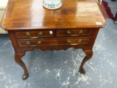 An 18th.c.and later walnut crossbanded and boxwood strung lowboy with three drawers on shaped