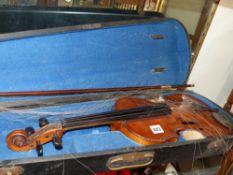 A 19th Century violin with single piece maple back. Bears label inside, complete with painted pink