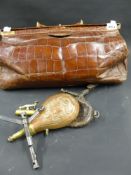 Two Military combination tools. A copper powder flask etc and a leather Gladstone bag