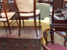 An Edwardian mahogany and inlaid tub armchair and three further chairs