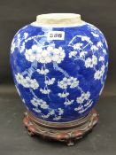 A Chinese blue and white prunus decorated ginger jar. Double encircled ring mark underfoot. Carved