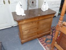 An antique marble top French fruitwood four drawer chest