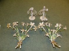 A pair of tole twin branch wall lights. With flowering lily motif and a pair of fittings decorated