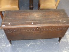 A 17th/18th.c.plank coffer with carved decoration