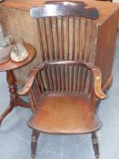 A 19th.c.beech and elm comb back armchair