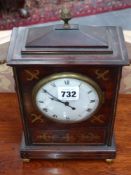 A small Regency mahogany and brass inlaid bracket clock