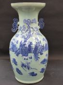 A Chinese blue and white twin handle baluster vase. Pale celadon ground with raised figural
