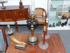 A Victorian oil lamp with green glass reservoir and three further lamps