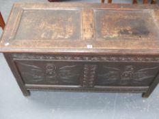 An 18th.C.Oak panelled coffer with carved decoration