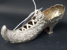 A silver hallmarked Continental model of a ladies shoe, floral decoration with pierced laces