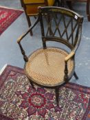 A Regency ebonised and painted decorated open armchair