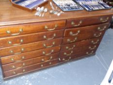 A large Antique mahogany chart or plan chest with twelve aligned deep drawers