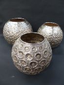 An unusual set of three Continental 900 globular vases with over all flower head decoration