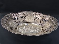 A large Continental 800 oval basket elaborate pierced figural and floral decoration