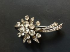 A silver paste set flower brooch