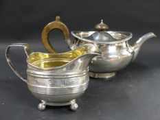 A George III silver teapot. With Greek key pattern border. London 1802. 18ozs all in. Together