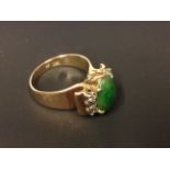 A 14ct diamond and jade set dress ring