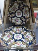 Two Worcester dishes. With scale blue borders, one painted with exotic birds in cartouches. The