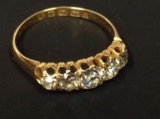 An 18ct gold five stone diamond ring