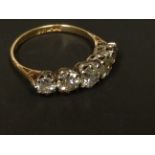 An 18ct gold and platinum set five stone diamond ring