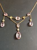 An art Nouveau amethyst and peridot necklace set single diamond