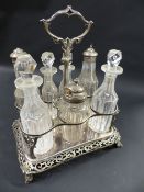 A Victorian silver plated seven bottle table cruet. With pierced border. 22cm wide