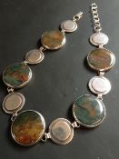 A contemporary silver necklace. Set with polished agate roundels. Birmingham 1973. Maker initials