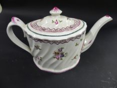 An early 19th Century Newhall style teapot. With wrythen body interspersed with foliate sprays. 14cm