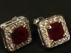 A pair of 14ct white gold diamond and ruby square shaoed earrings