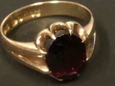 A 9ct gold garnet set dress ring