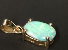 A 14ct gold opal pendant