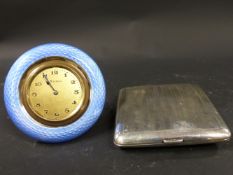 A silver cased travelling watch. London 1911. Together with a gullioche blue enamel travelling