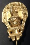 A Pre-Columbian gold coloured figurative icon possibly from Veraguas region. 4cm high