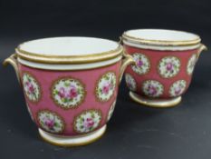 A pair of Sevres porcelain cache pots. With pink pompadom ground. Interspersed with rose medallions.