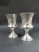 A pair of Victorian silver goblets. Dated London 1841. Joseph Angell Sn62 JNR. 14cm high. 11ozs