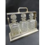 A plated mounted three decanter tantalus