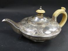 A batchelors silver teapot. With ivory handle and finial. London 1829. Makers Barnard Family. 10.