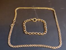 A 9ct gold chain. 10grms. Together with a yellow precious metal bracelet stamped 18ct. 11grams