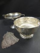 A silver rose bowl. With repousse swag border. London hallmarks. Date letter rubbed makers Charles