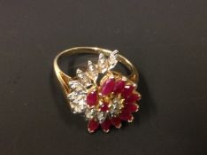 A 10k diamond and ruby dress ring