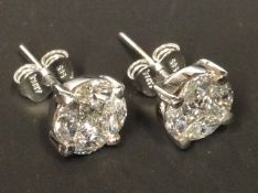 A pair of 14ct white gold diamond cluster earrings. Approximately 2cr