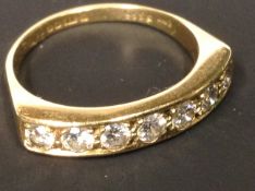 An 18ct gold seven stone brilliant cut diamond ring