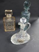 A Moser glass decanter. A cylindrical green tined glass decanter and a claret decanter (3)