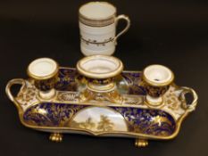 A 19th Century Derby inkstand. With hand painted cartouches depicting landscape scenes. 20 x 15cm.
