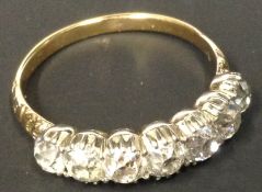 A diamond seven stone ring. Set with old cut diamonds