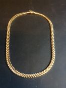A modern 9ct gold necklace. 27.5grms