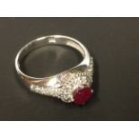 A 14ct white gold ruby and diamond cluster ring