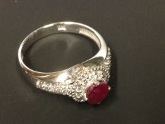 A 14ct white gold ruby and diamond cluster ring