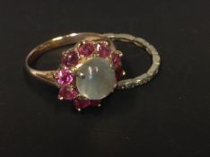 A circa 1920's moonstone and pink gem set cluster ring. Together with an eternirty ring (2)