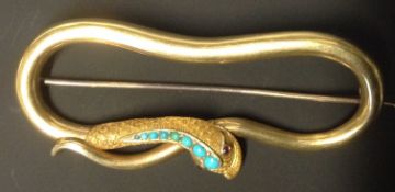 A Victorian gold coloured precious metal brooch. Of serpent form set with tuquoise